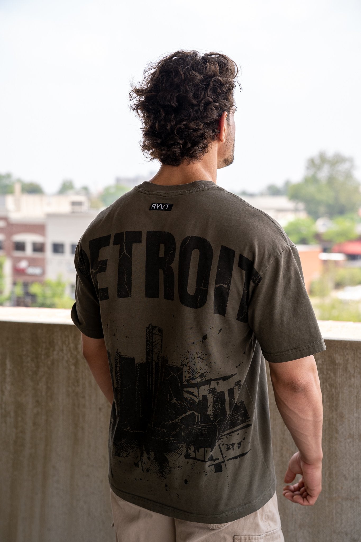 Army Green Detroit Renaissance Heavyweight Tee, on model, rear view