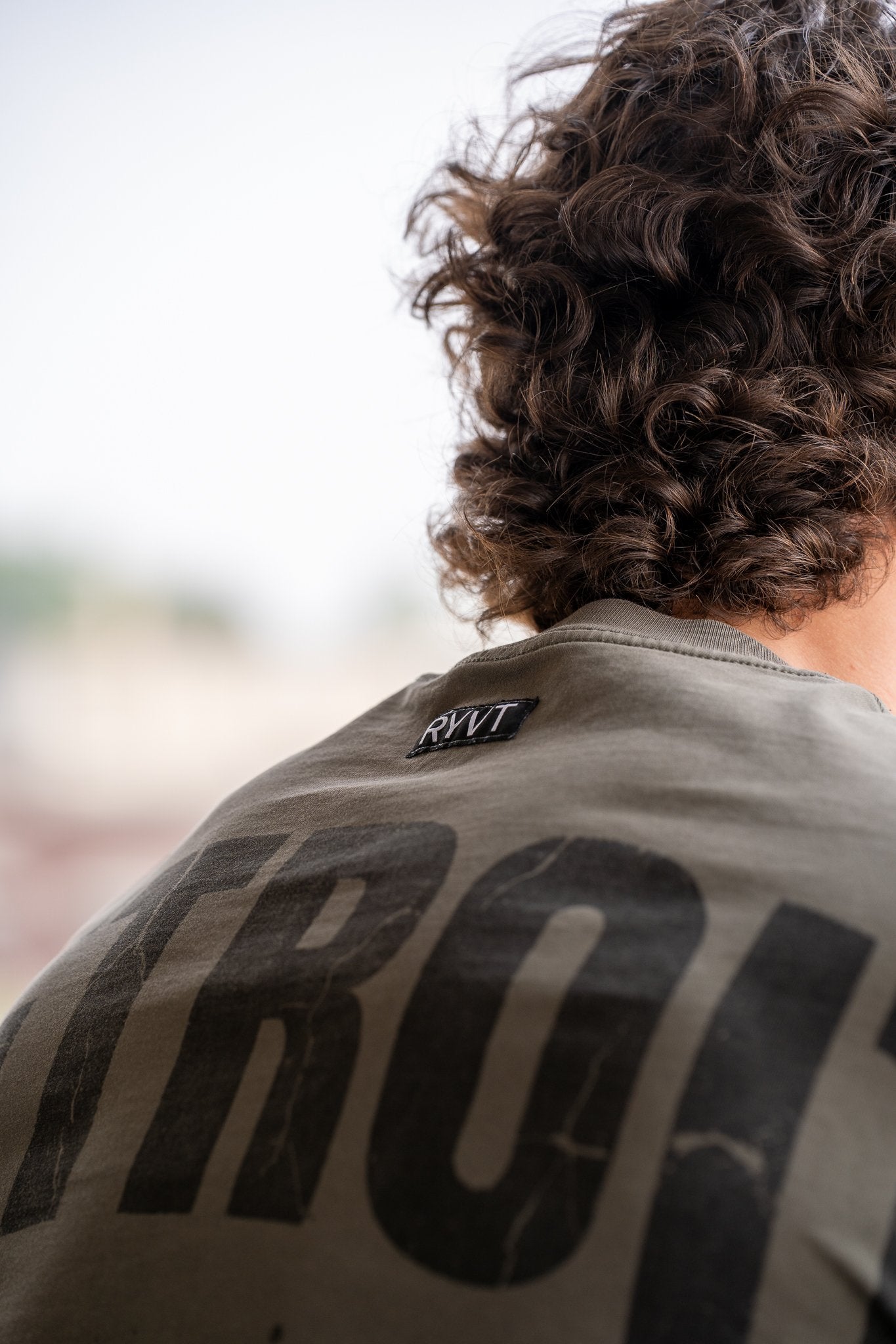 Army Green Detroit Renaissance Heavyweight Tee, on model, detail view