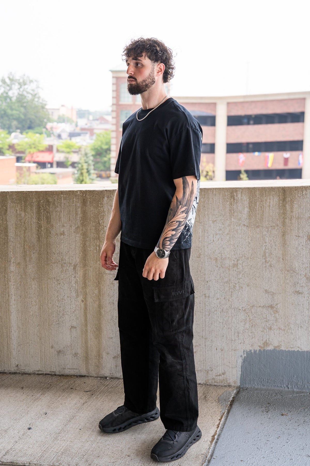 Black Detroit Renaissance Heavyweight Tee, on model, side view