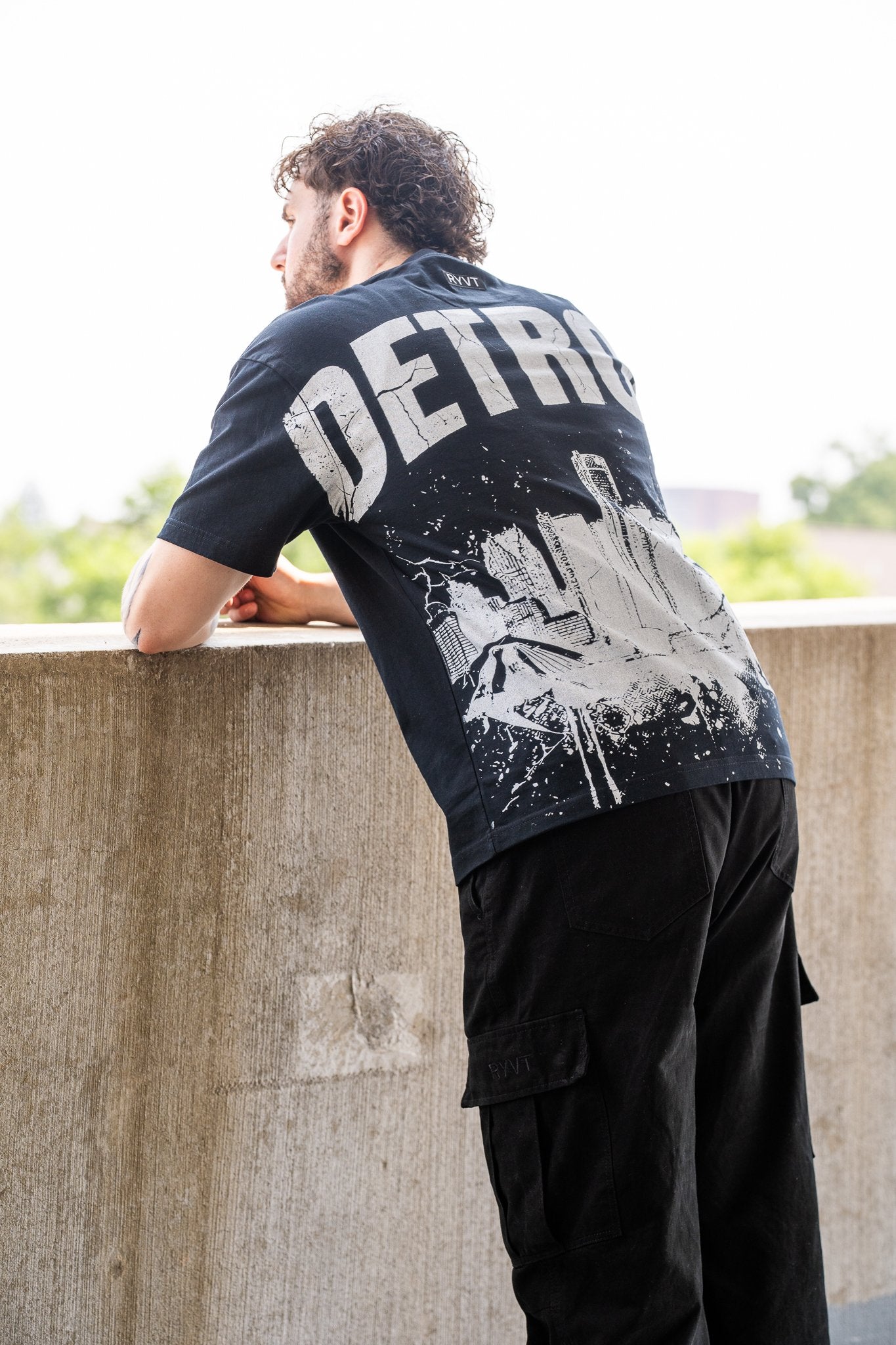 Black Detroit Renaissance Heavyweight Tee, on model, three-quarter view