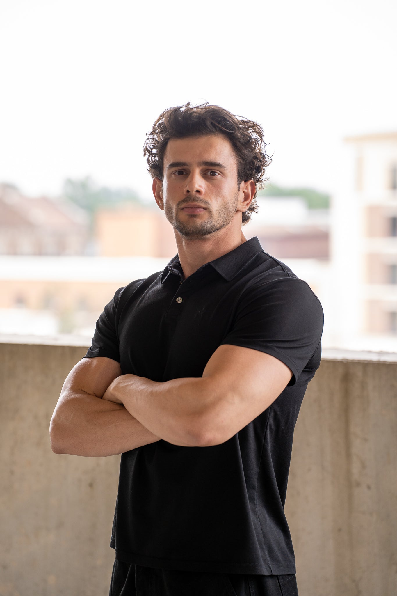 Black Executive Polo, on model, front view