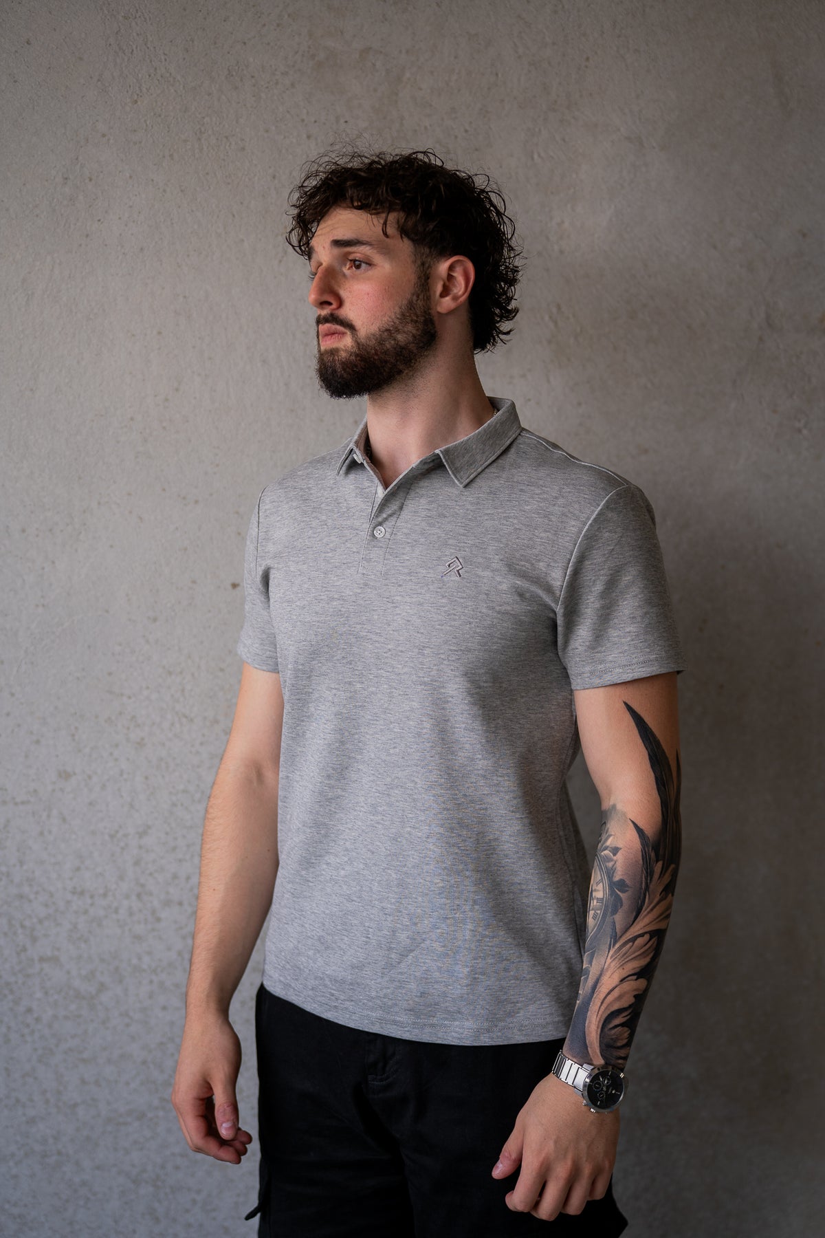 Grey Executive Polo, on model, three-quarter view