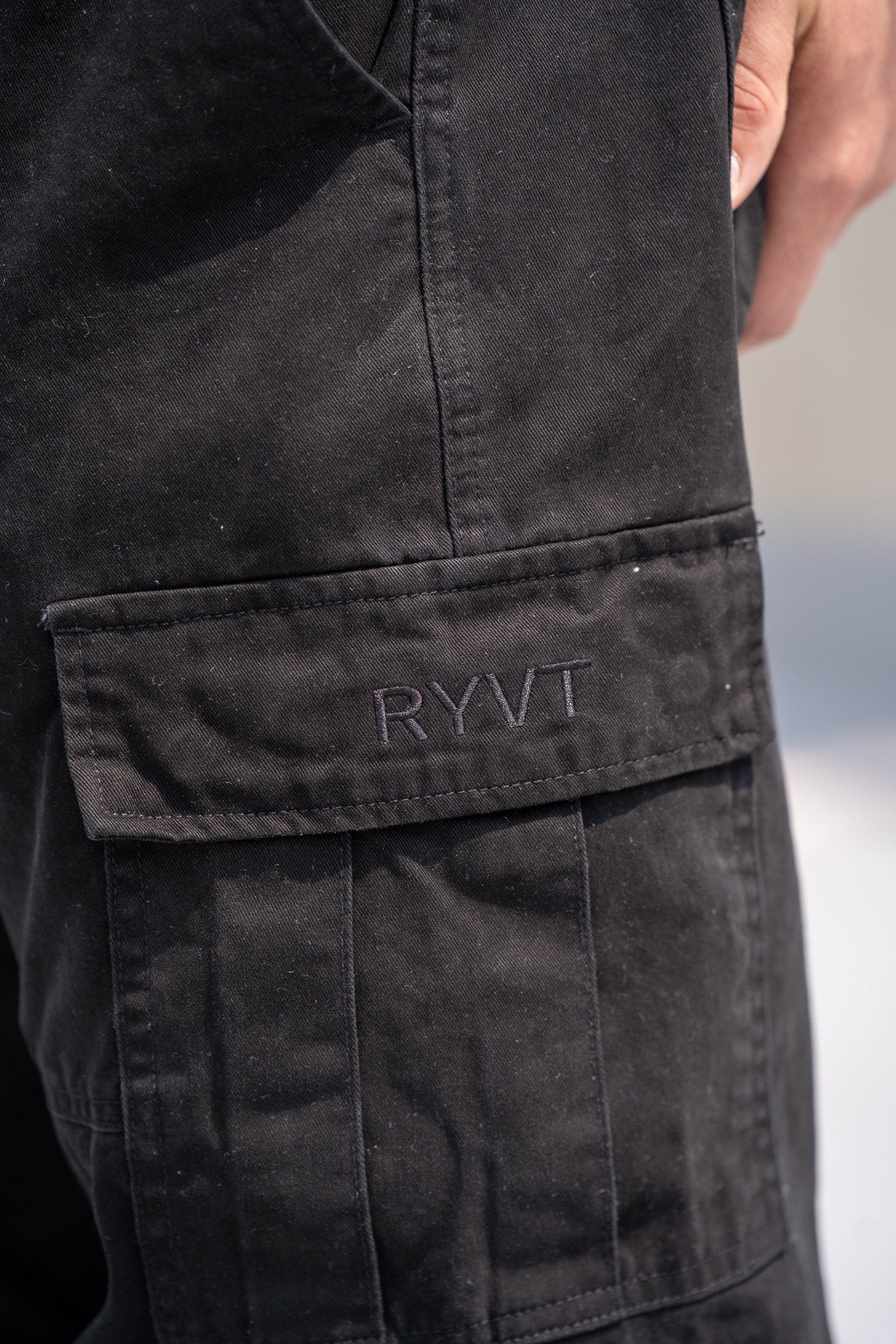 Black Standard-Issue Cargo Pants, on model, detail view